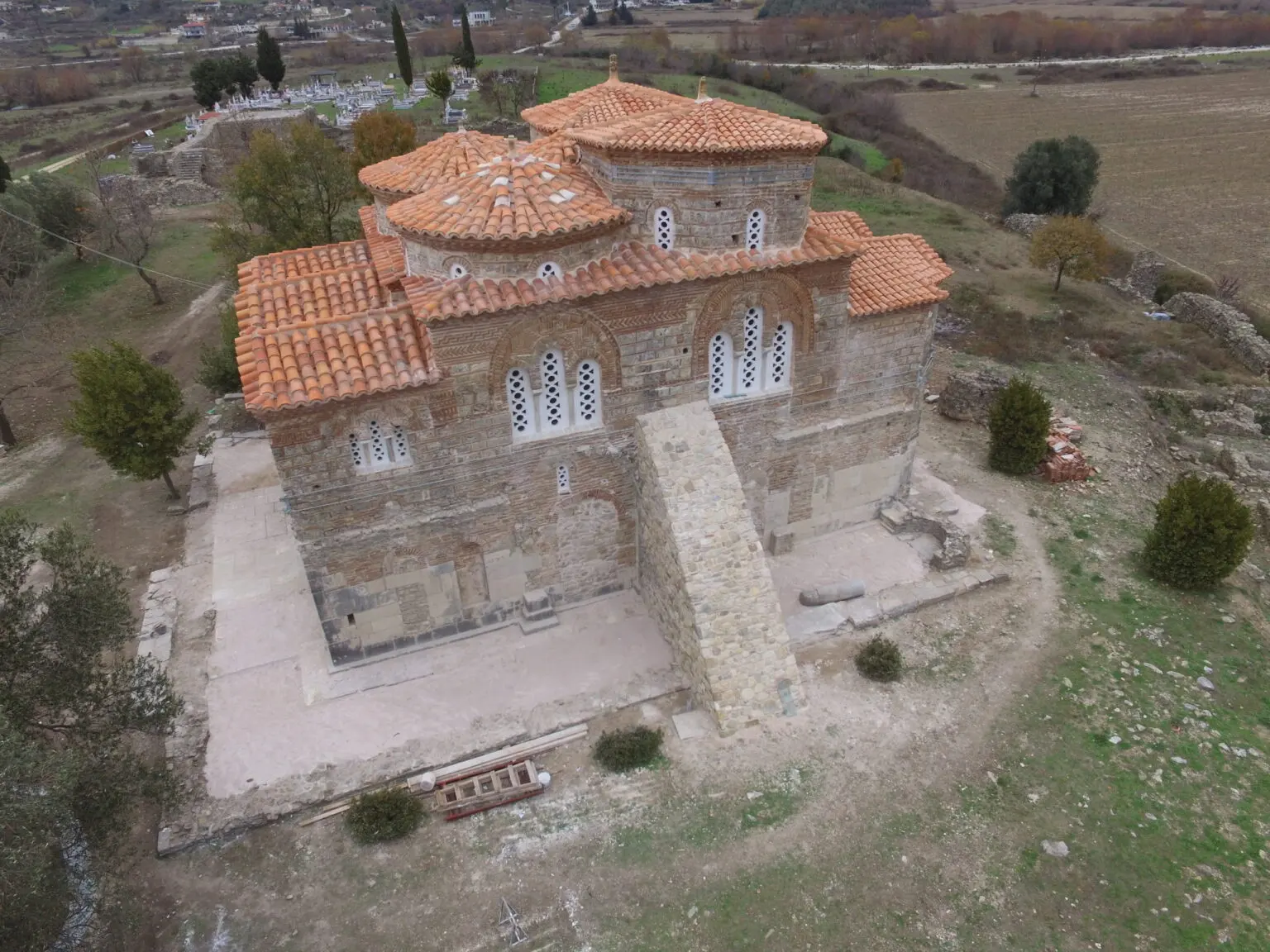 The stone architecture and terracotta roofs of Mesopotam Church in Albania.